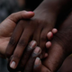 Students from the University of South Carolina and South Carolina State University link hands on the grounds of the Statehouse June 23, 2015, in Columbia, S.C., during a moment of silence for the nine victims of the shooting at Emanuel African Methodist Episcopal Church in Charleston, S.C.
Win McNamee/Getty Images